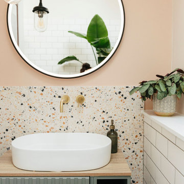 Pink & green bathroom with mix of tiles & patterns