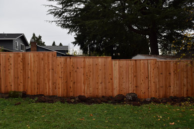 This is an example of a transitional wood fence landscaping in Portland.