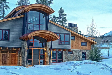 Mid-sized minimalist gray two-story mixed siding exterior home photo in Denver with a hip roof