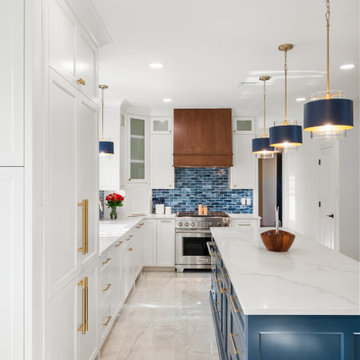 Kitchen Aisle Perspective Between White Pantry Cabinets and Navy Island