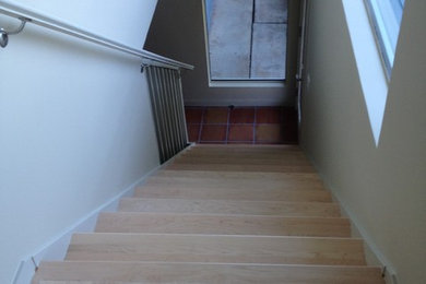 Staircase - traditional wooden metal railing staircase idea in San Francisco with metal risers