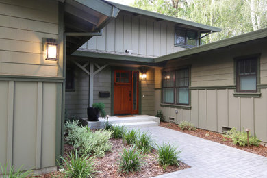 Photo of a large two-storey house exterior in Sacramento with wood siding.