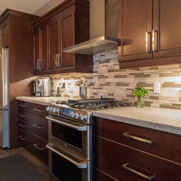 Falsetta - Brown Cabinets with Mosaic Tile Backsplash