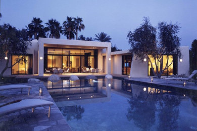 Mid-sized contemporary beige one-story stucco exterior home idea in Los Angeles