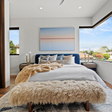 Modern Luxury Lakehouse Guest Bedroom with Panoramic Windows and Cozy Layered Fi