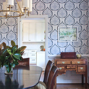 Country dark wood floor and brown floor dining room photo in Richmond with a corner fireplace and a stone fireplace
