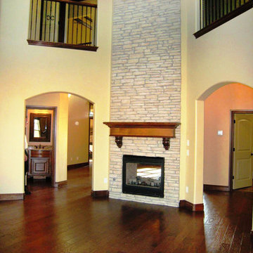 Open 2-story living with multiple balconies