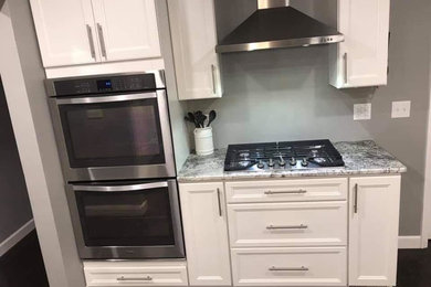 Kitchen - kitchen idea in Other with an island