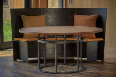 Inspiration for a mid-sized rustic medium tone wood floor kitchen/dining room combo remodel in San Francisco with brown walls and no fireplace