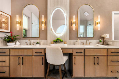 Large transitional master beige tile and porcelain tile porcelain tile, beige floor, double-sink and vaulted ceiling bathroom photo in Austin with shaker cabinets, medium tone wood cabinets, a one-piece toilet, beige walls, an undermount sink, quartz countertops, a hinged shower door, white countertops and a built-in vanity