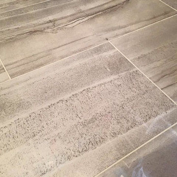New tile flooring keeps the dust-bunnies at bay! Rectangular ceramic tiles in gr