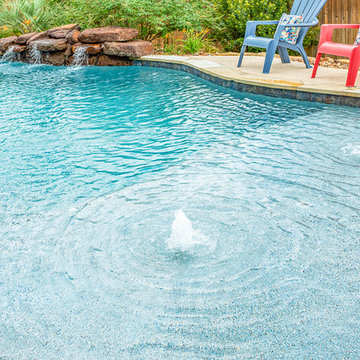 Freeform Pool, beach entry and rock waterfall