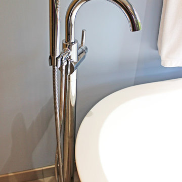 Master Bathroom with Free Standing Tub, Quartz Countertop and Grey Tiled Shower