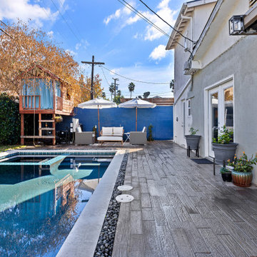 Modern black pebble pool & spa | small backyard