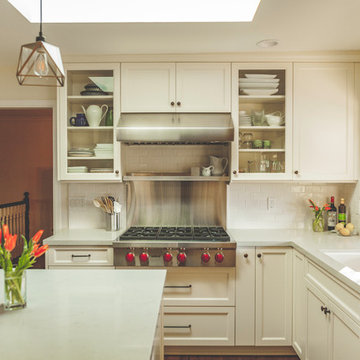L Shaped Countertop With Island in White Kitchen