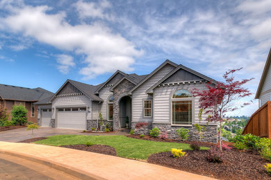 Large traditional beige one-story mixed siding house exterior idea in Portland