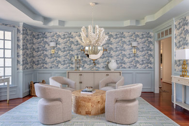 Living room - traditional enclosed dark wood floor, brown floor, tray ceiling, wainscoting and wallpaper living room idea in Raleigh with multicolored walls