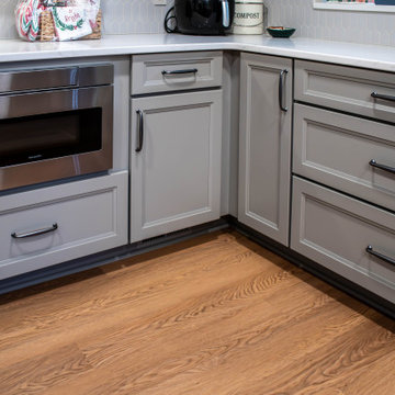 Two-Tone Neutral Kitchen with Quartz Countertop and Soho Picket Backsplash