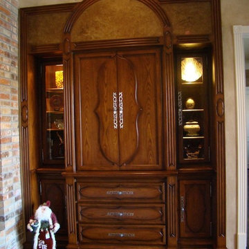 Lighted display equipment cabinet with hand made applied door and drawer plaques