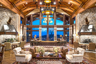 Inspiration for a huge craftsman open concept medium tone wood floor living room remodel in New York with gray walls, a standard fireplace, a stone fireplace and no tv