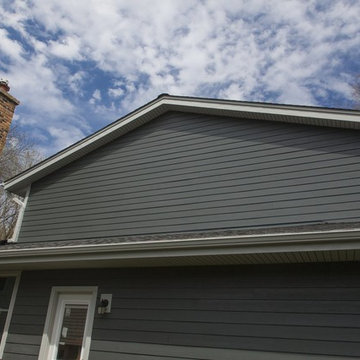 Blue Sky View of Exterior renovation with Hardie Iron Gray