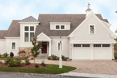 Example of a classic white two-story wood exterior home design in Boston