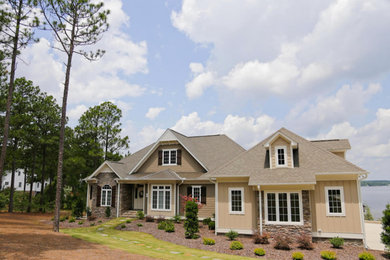 Example of a large arts and crafts two-story exterior home design in Raleigh
