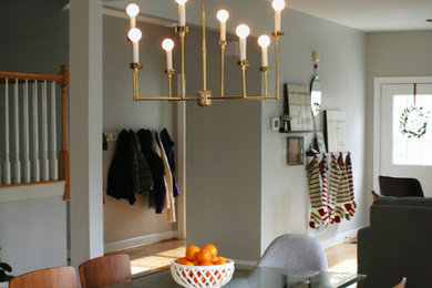 Example of a trendy medium tone wood floor dining room design in San Francisco with gray walls