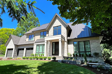 Large transitional brown two-story stone exterior home photo in Toronto with a mixed material roof and a brown roof