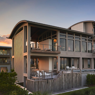 Sunset Exterior of a Contemporary Figure Eight Island Oceanfront Home