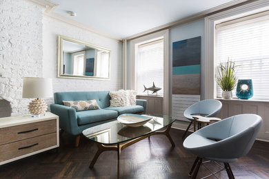 Beach style dark wood floor and brown floor living room photo in New York with white walls