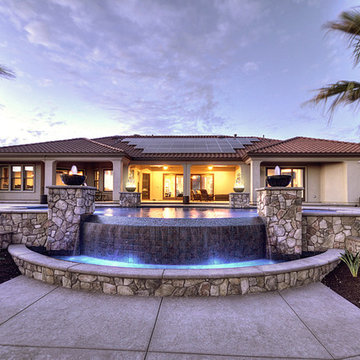 Rear elevation with solar, infinity pool and landscaping.