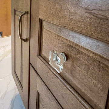 Primary Bath with Marble Look Tiled Shower and Free Standing Tub
