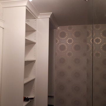 New closets with sheving and crown moulding on existing Ikea cabinets