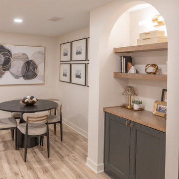 Warm & Inviting Basement Retreat with Custom Bar + Entertainment Center