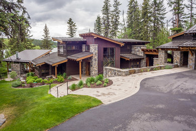 Mountain style beige two-story mixed siding house exterior photo in Seattle with a shed roof