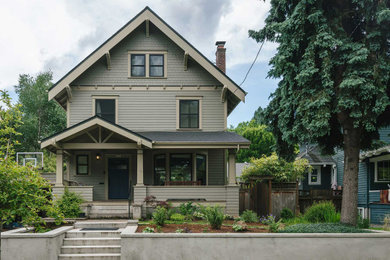Large craftsman green four-story wood and clapboard exterior home idea in Portland with a shingle roof and a black roof