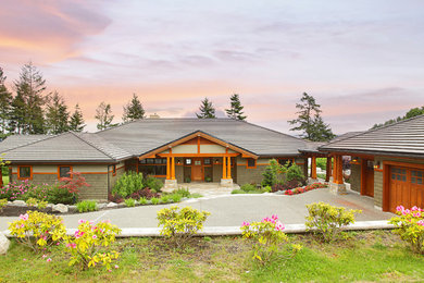 Example of a large classic green one-story mixed siding house exterior design in Seattle with a hip roof and a shingle roof
