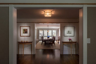 Enclosed dining room - contemporary dark wood floor and brown floor enclosed dining room idea in Boston with beige walls and no fireplace