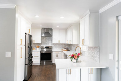 Inspiration for a contemporary l-shaped laminate floor and brown floor kitchen remodel in Salt Lake City with a drop-in sink, shaker cabinets, white cabinets, quartz countertops, gray backsplash and white countertops