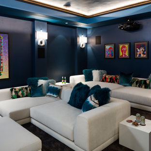 Inspiration for a traditional enclosed home cinema in Other with blue walls, carpet, a projector screen and brown floors.