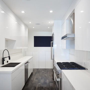 Bright Galley Kitchen With Stainless Gas Range