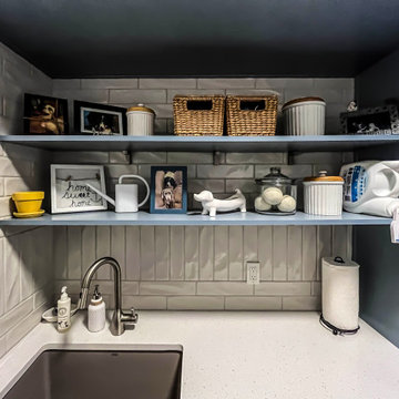 Laundry Room with Blue Painted Cabinetry and Sparkling White Quartz Countertops