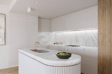 Large contemporary galley eat-in kitchen in Melbourne with a double-bowl sink, beaded inset cabinets, white cabinets, marble benchtops, white splashback, marble splashback, coloured appliances, light hardwood floors, with island, beige floor, white benchtop and wallpaper.