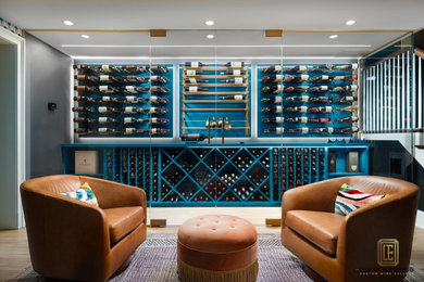 Example of a mid-sized trendy light wood floor wine cellar design in Chicago
