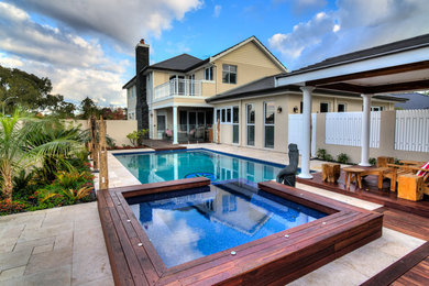 Inspiration for a contemporary backyard rectangular lap pool in Perth with a hot tub.