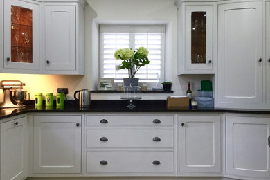 Design ideas for a traditional kitchen in Sussex with an island.