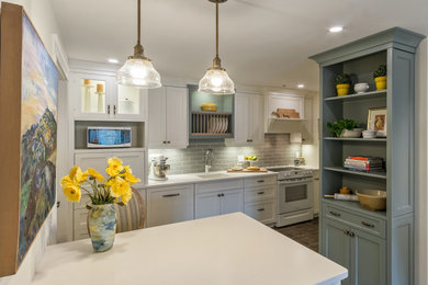 Inspiration for a timeless kitchen remodel in Other with a single-bowl sink, beaded inset cabinets, quartzite countertops, gray backsplash, subway tile backsplash, white appliances, a peninsula and white countertops