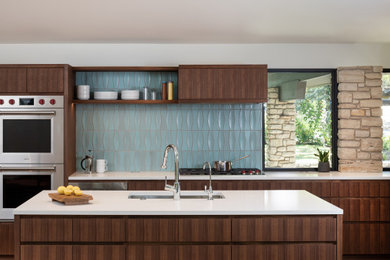 Kitchen - mid-century modern kitchen idea in Austin