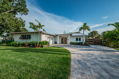 Transitional exterior home photo in Tampa with a metal roof